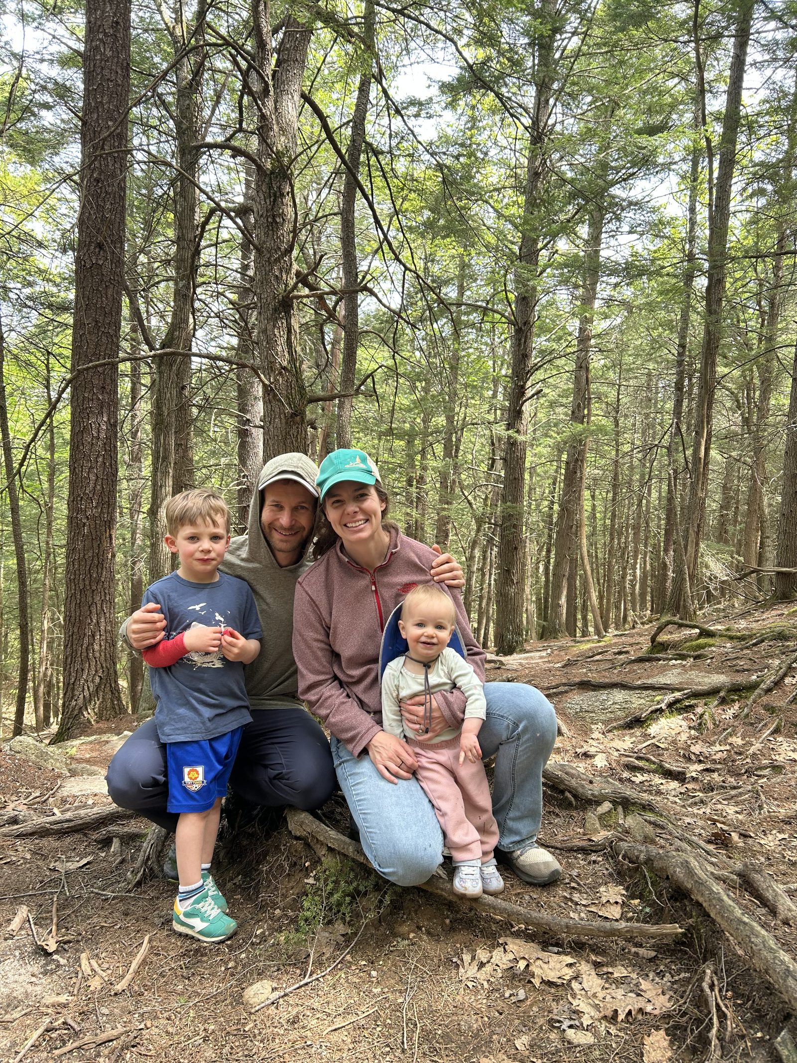 The Gersten family on a hike among the pines in Maine